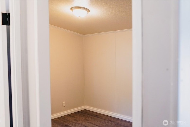 8805 226th Street Ct E Unit 32, Graham, WA 98338 - unfurnished room featuring dark wood-type flooring, crown molding, and a textured ceiling