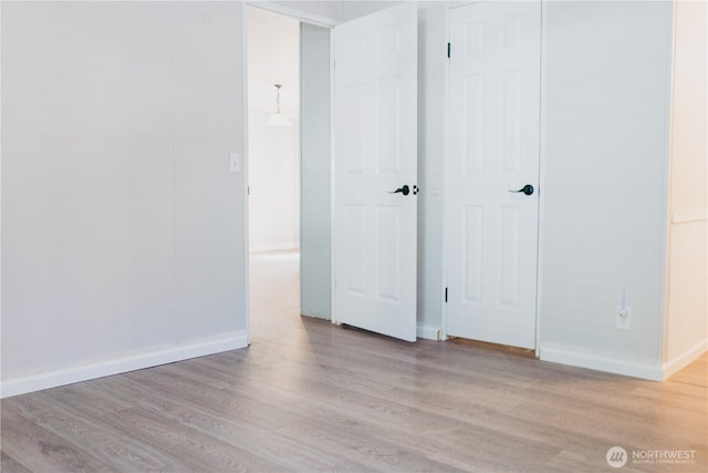 8805 226th Street Ct E Unit 32, Graham, WA 98338 - unfurnished bedroom featuring wood finished floors and a closet