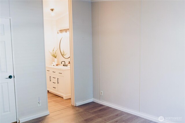 8805 226th Street Ct E Unit 32, Graham, WA 98338 - unfurnished bedroom featuring light wood-style floors, crown molding, and ensuite bath