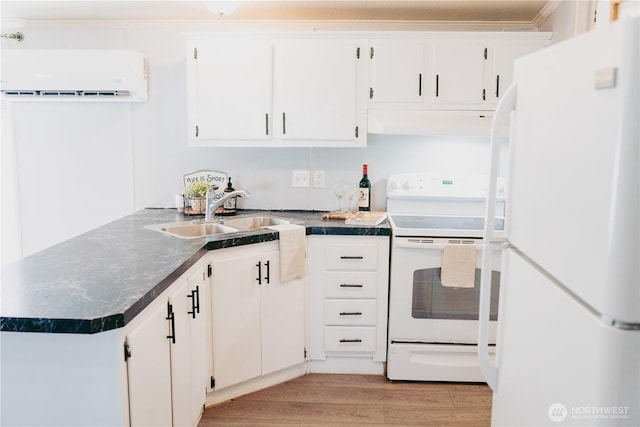 8805 226th Street Ct E Unit 32, Graham, WA 98338 - kitchen featuring white appliances, a wall unit AC, dark countertops, light wood-type flooring, and crown molding