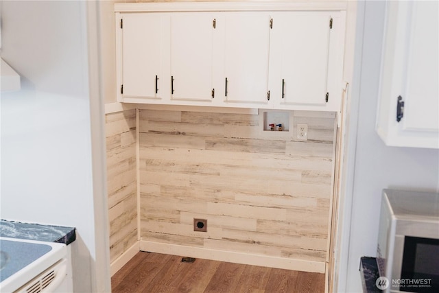 8805 226th Street Ct E Unit 32, Graham, WA 98338 - laundry room featuring hookup for a washing machine, cabinet space, hookup for an electric dryer, and wood finished floors