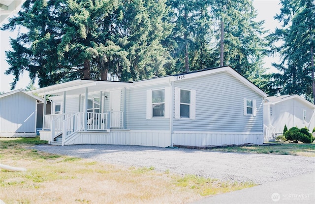 8805 226th Street Ct E Unit 32, Graham, WA 98338 - manufactured / mobile home featuring a porch and a shed
