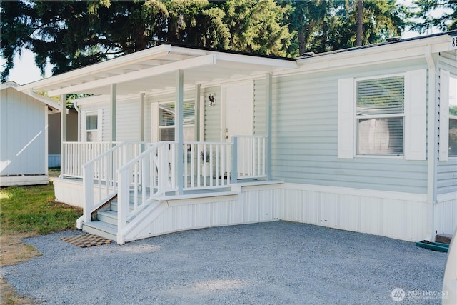 8805 226th Street Ct E Unit 32, Graham, WA 98338 - manufactured / mobile home featuring covered porch