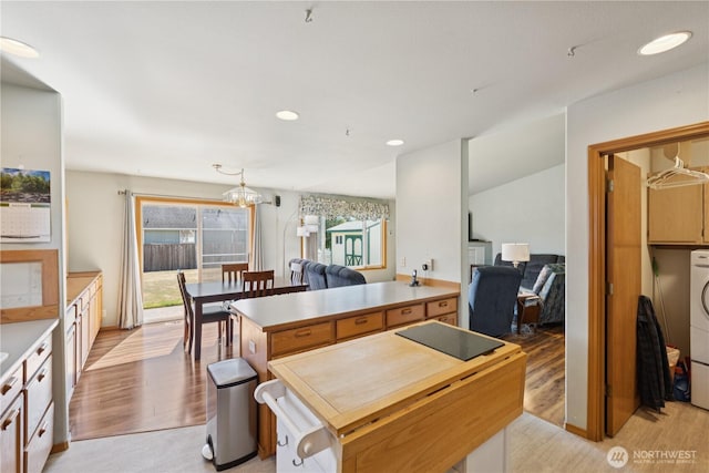 3519 G Ave, Anacortes, WA 98221 - kitchen with light wood-type flooring, a chandelier, pendant lighting, open floor plan, and recessed lighting