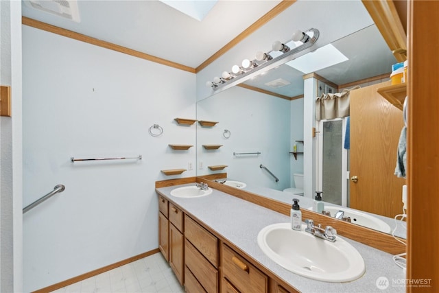 3519 G Ave, Anacortes, WA 98221 - full bath featuring ornamental molding, double vanity, a shower with door, tile patterned floors, and a skylight