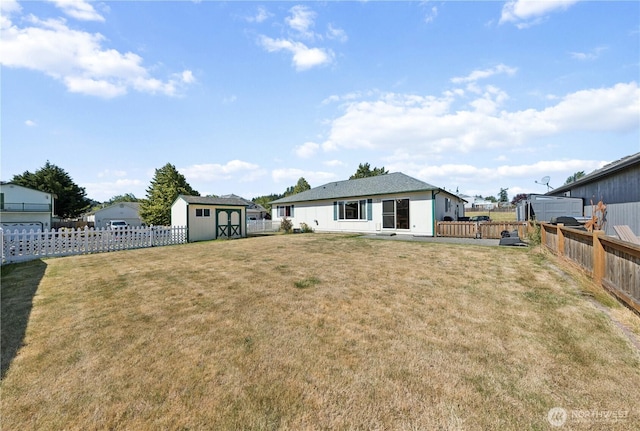 3519 G Ave, Anacortes, WA 98221 - rear view of house with a storage unit and a fenced backyard