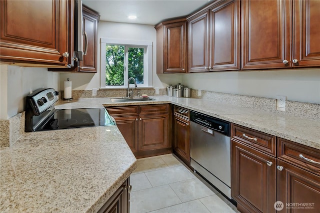 418 Jefferson St, Centralia, WA 98531 - kitchen featuring stainless steel appliances, light tile patterned floors, and light stone counters