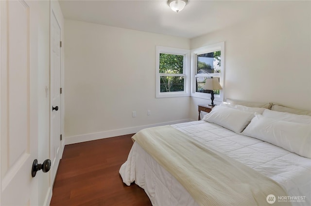 418 Jefferson St, Centralia, WA 98531 - bedroom with dark wood-style flooring and baseboards