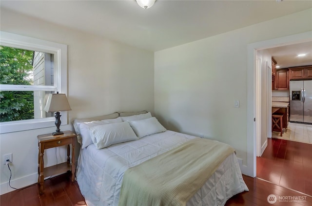 418 Jefferson St, Centralia, WA 98531 - bedroom featuring stainless steel fridge with ice dispenser and wood finished floors