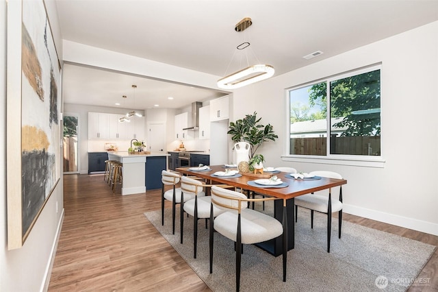 1515 243rd Pl SW Unit A, Bothell, WA 98012 - dining room with light wood-style flooring and baseboards