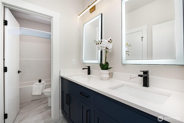 1515 243rd Pl SW Unit A, Bothell, WA 98012 - bathroom featuring double vanity, marble look tiles, and a tub