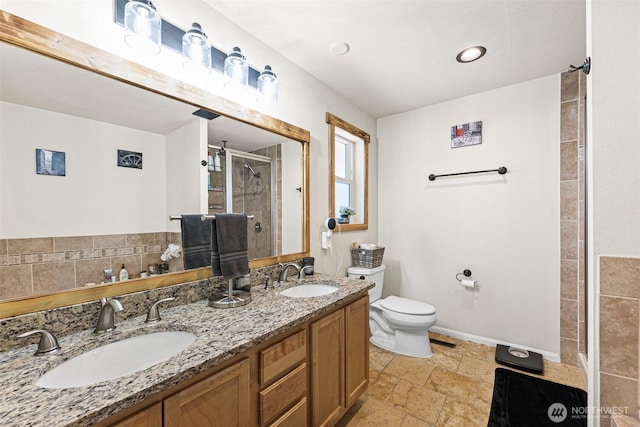 20311 Orting Kapowsin Hwy E, Graham, WA 98338 - bathroom with a stall shower, double vanity, and stone tile flooring