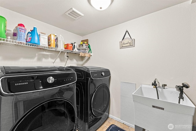 20311 Orting Kapowsin Hwy E, Graham, WA 98338 - laundry area featuring washer and dryer and light tile patterned floors