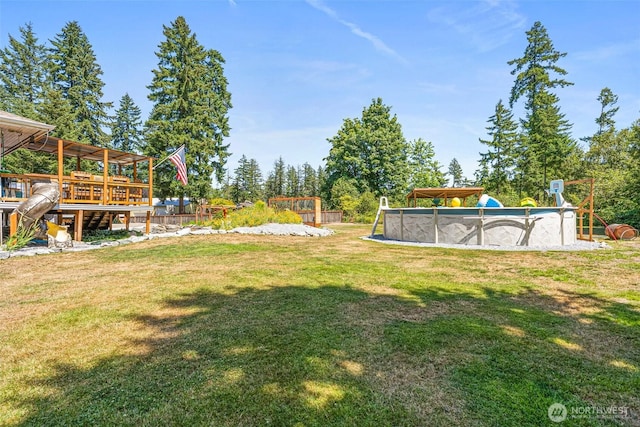 20311 Orting Kapowsin Hwy E, Graham, WA 98338 - view of grassy yard with an outdoor pool and a wooden deck