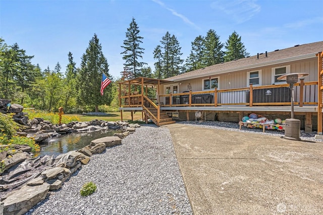 20311 Orting Kapowsin Hwy E, Graham, WA 98338 - back of house featuring a deck and a shingled roof