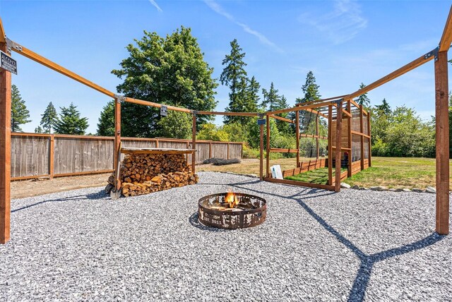 20311 Orting Kapowsin Hwy E, Graham, WA 98338 - fenced backyard with an outdoor fire pit