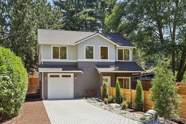 11737 38th Ave NE Unit A, Seattle, WA 98125 - view of front of house with roof with shingles, decorative driveway, and a garage