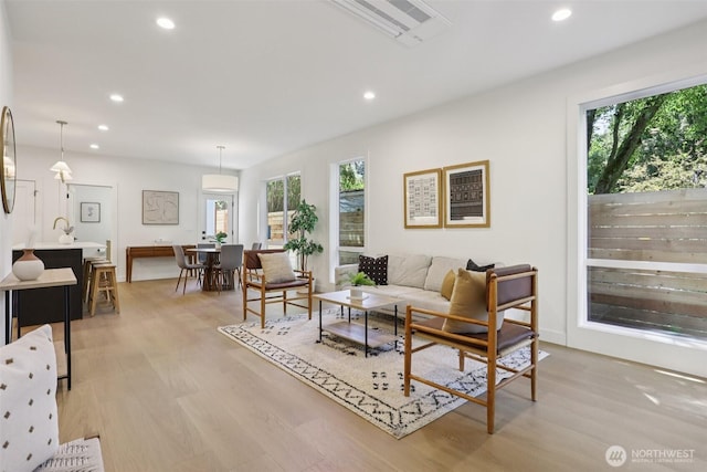 11737 38th Ave NE Unit A, Seattle, WA 98125 - living room with recessed lighting and light wood-style floors