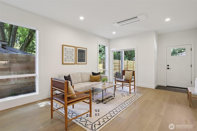 11737 38th Ave NE Unit A, Seattle, WA 98125 - living area with light wood-style floors and recessed lighting