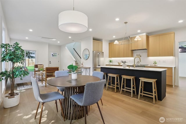 11737 38th Ave NE Unit A, Seattle, WA 98125 - dining room featuring light wood-style floors, stairs, and recessed lighting