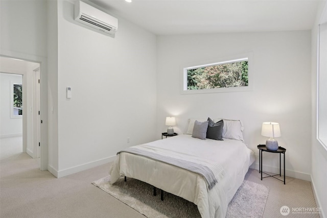 11737 38th Ave NE Unit A, Seattle, WA 98125 - carpeted bedroom with a wall mounted AC and baseboards