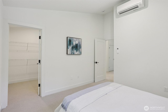 11737 38th Ave NE Unit A, Seattle, WA 98125 - bedroom featuring a wall mounted AC, carpet, and a walk in closet