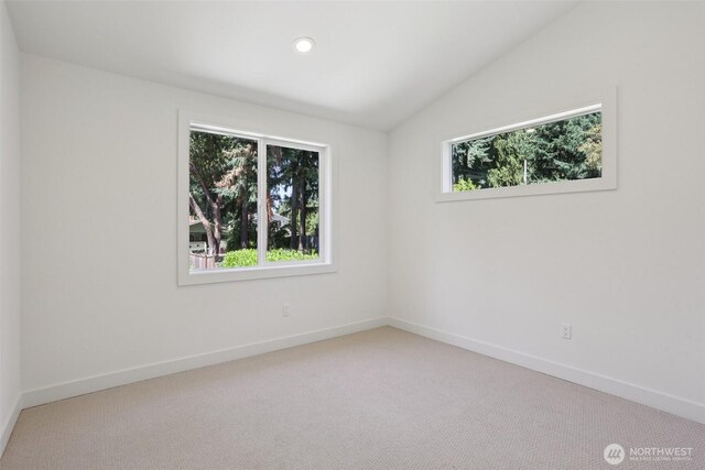 11737 38th Ave NE Unit A, Seattle, WA 98125 - carpeted spare room featuring vaulted ceiling and recessed lighting