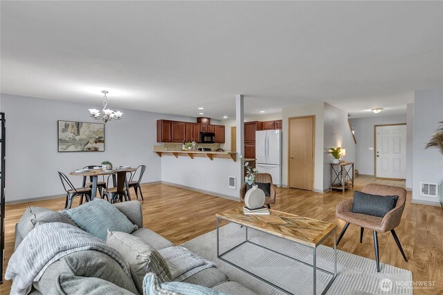 1302 110th St E Unit 37, Tacoma, WA 98445 - living area with a chandelier, recessed lighting, and light wood finished floors