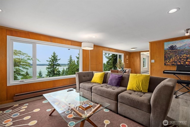 118 Highland Dr, Bellingham, WA 98225 - living area with baseboard heating, wooden walls, wood finished floors, and recessed lighting