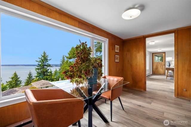 118 Highland Dr, Bellingham, WA 98225 - dining area featuring light wood finished floors, healthy amount of natural light, wooden walls, and a water view