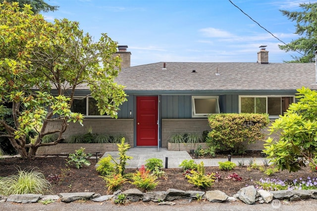 118 Highland Dr, Bellingham, WA 98225 - ranch-style house with a chimney, roof with shingles, and board and batten siding