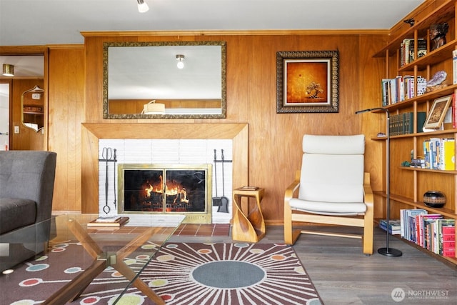 118 Highland Dr, Bellingham, WA 98225 - living area with wooden walls, wood finished floors, and a tiled fireplace