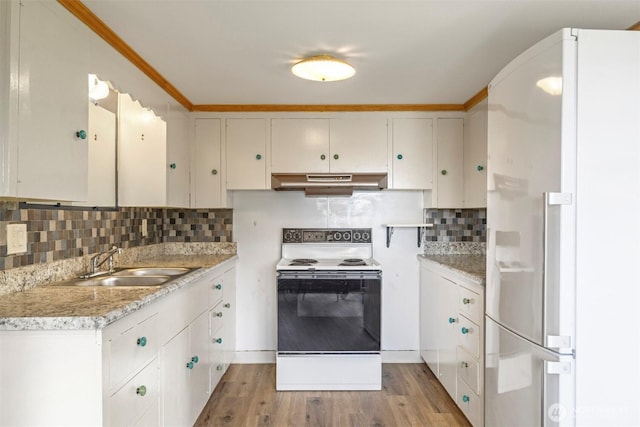 118 Highland Dr, Bellingham, WA 98225 - kitchen with white appliances, exhaust hood, decorative backsplash, light countertops, and light wood-style floors