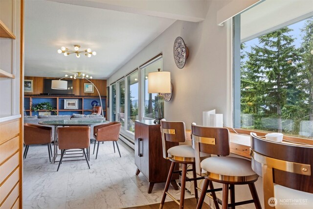 118 Highland Dr, Bellingham, WA 98225 - dining space with a chandelier, a baseboard heating unit, and marble finish floors