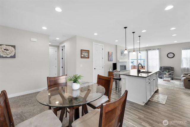 397 N Foster St, Buckley, WA 98321 - dining space with recessed lighting, light wood-style floors, and a fireplace
