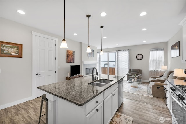 397 N Foster St, Buckley, WA 98321 - kitchen featuring open floor plan, appliances with stainless steel finishes, wood finished floors, and recessed lighting