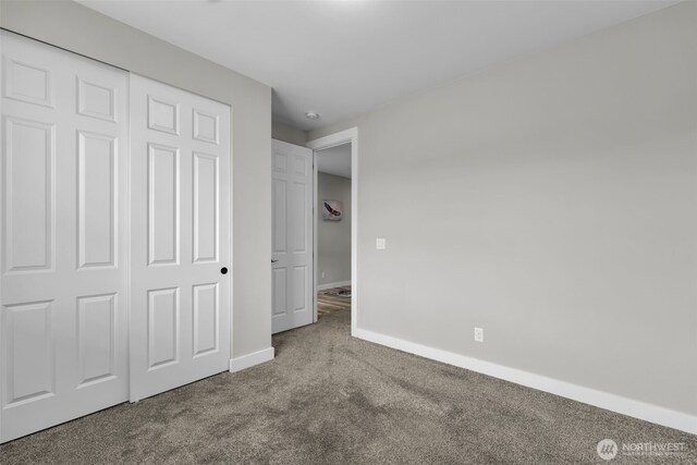 397 N Foster St, Buckley, WA 98321 - unfurnished bedroom featuring carpet flooring and a closet