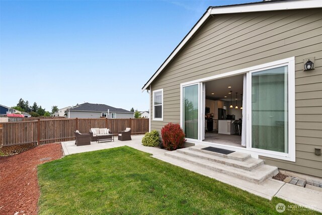 397 N Foster St, Buckley, WA 98321 - fenced backyard with an outdoor living space, a patio area, and entry steps