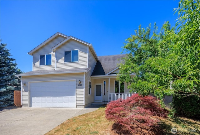 2537 Kristine Ct, Centralia, WA 98531 - traditional home featuring covered porch, an attached garage, and driveway