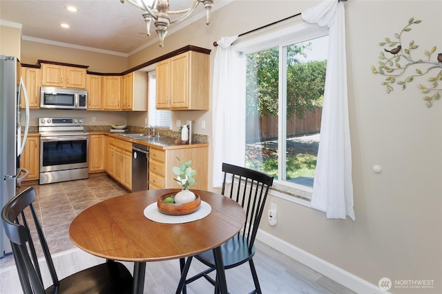 2537 Kristine Ct, Centralia, WA 98531 - kitchen featuring appliances with stainless steel finishes, light brown cabinetry, ornamental molding, and recessed lighting