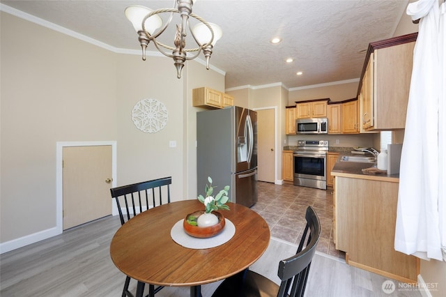 2537 Kristine Ct, Centralia, WA 98531 - dining room featuring a chandelier, recessed lighting, ornamental molding, light wood-style floors, and a textured ceiling