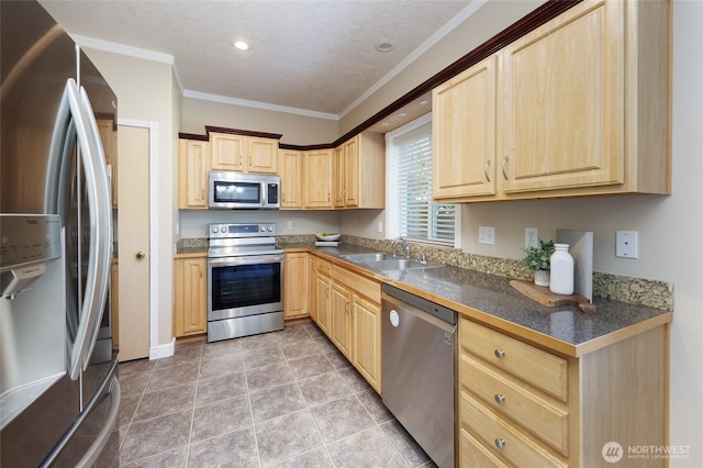 2537 Kristine Ct, Centralia, WA 98531 - kitchen with appliances with stainless steel finishes, light brown cabinetry, dark countertops, crown molding, and recessed lighting