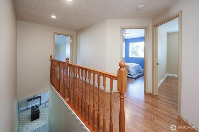 2537 Kristine Ct, Centralia, WA 98531 - hall featuring an upstairs landing, light wood-style floors, recessed lighting, and a textured ceiling
