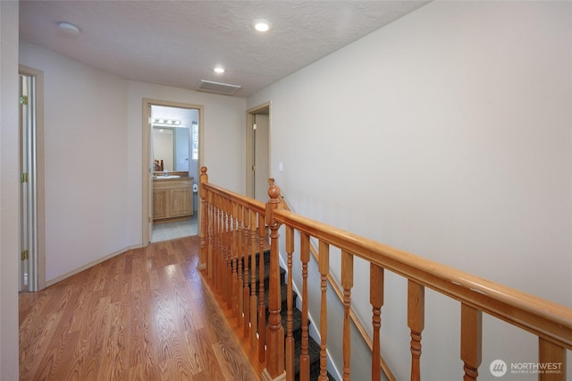 2537 Kristine Ct, Centralia, WA 98531 - corridor with an upstairs landing, light wood finished floors, and recessed lighting