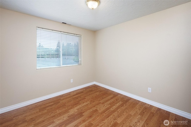 2537 Kristine Ct, Centralia, WA 98531 - empty room with light wood-style floors and baseboards