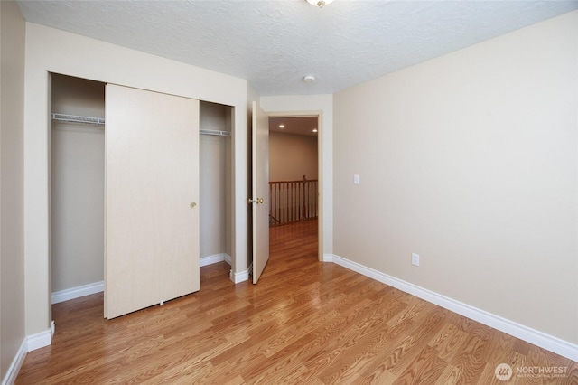 2537 Kristine Ct, Centralia, WA 98531 - unfurnished bedroom featuring light wood-type flooring and a closet