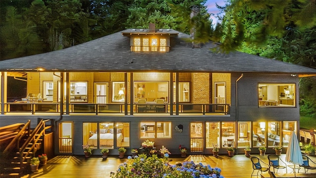 5222 Mahncke Rd SW, Longbranch, WA 98351 - rear view of house featuring roof with shingles and a balcony