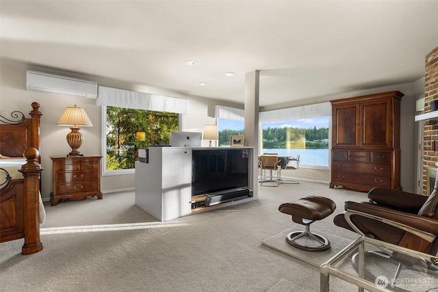 5222 Mahncke Rd SW, Longbranch, WA 98351 - living room featuring a wall mounted AC, light colored carpet, and a fireplace