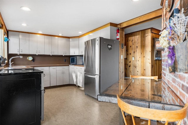 5222 Mahncke Rd SW, Longbranch, WA 98351 - kitchen with appliances with stainless steel finishes, white cabinets, and recessed lighting