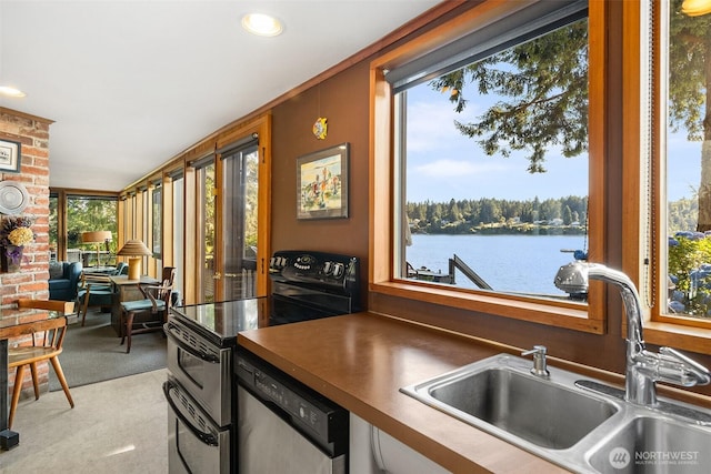 5222 Mahncke Rd SW, Longbranch, WA 98351 - kitchen featuring electric stove, dishwasher, dark countertops, a water view, and open floor plan